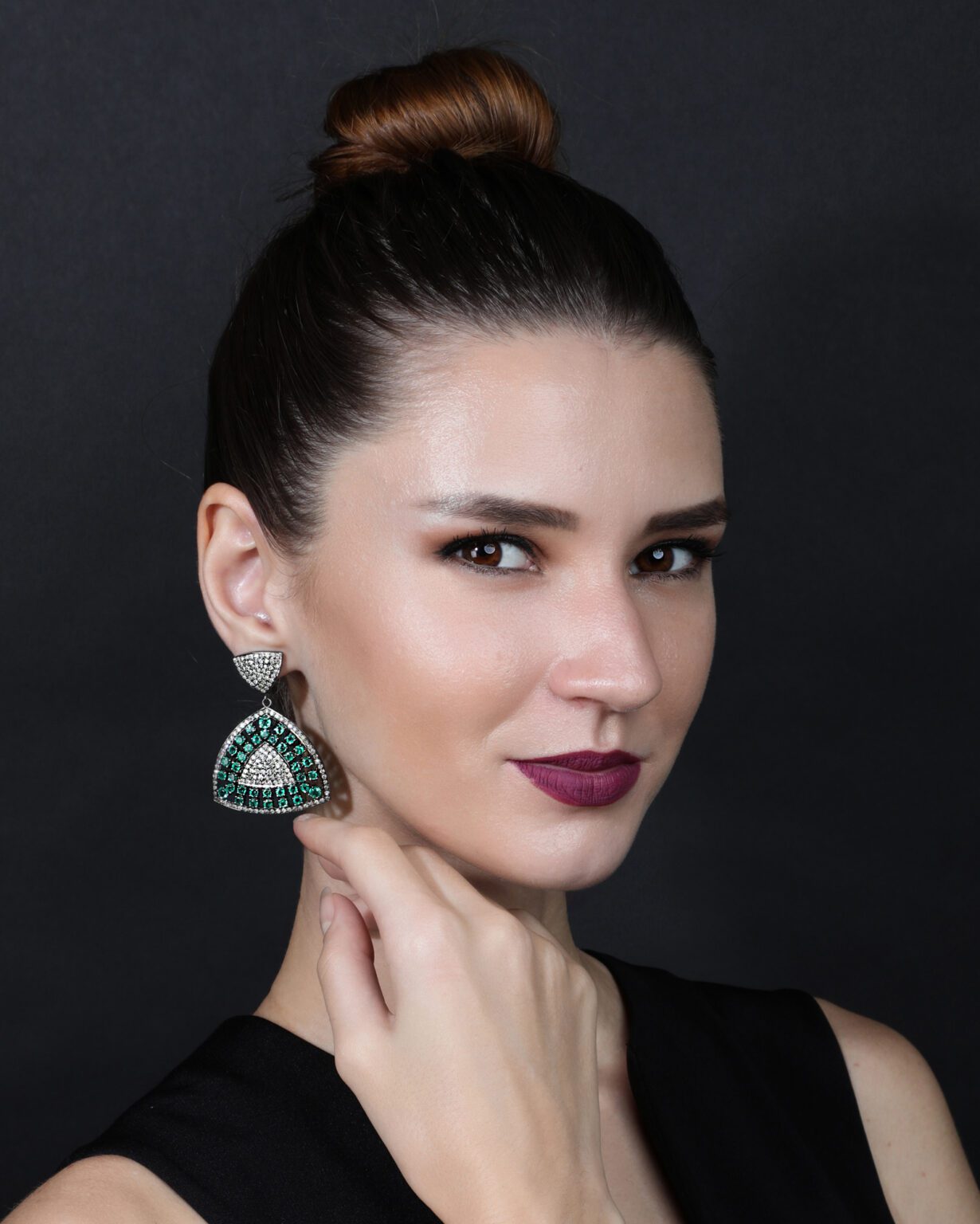 Model wearing luxury gemstone earrings captured in jewellery campaign photography by Productpixels Singapore