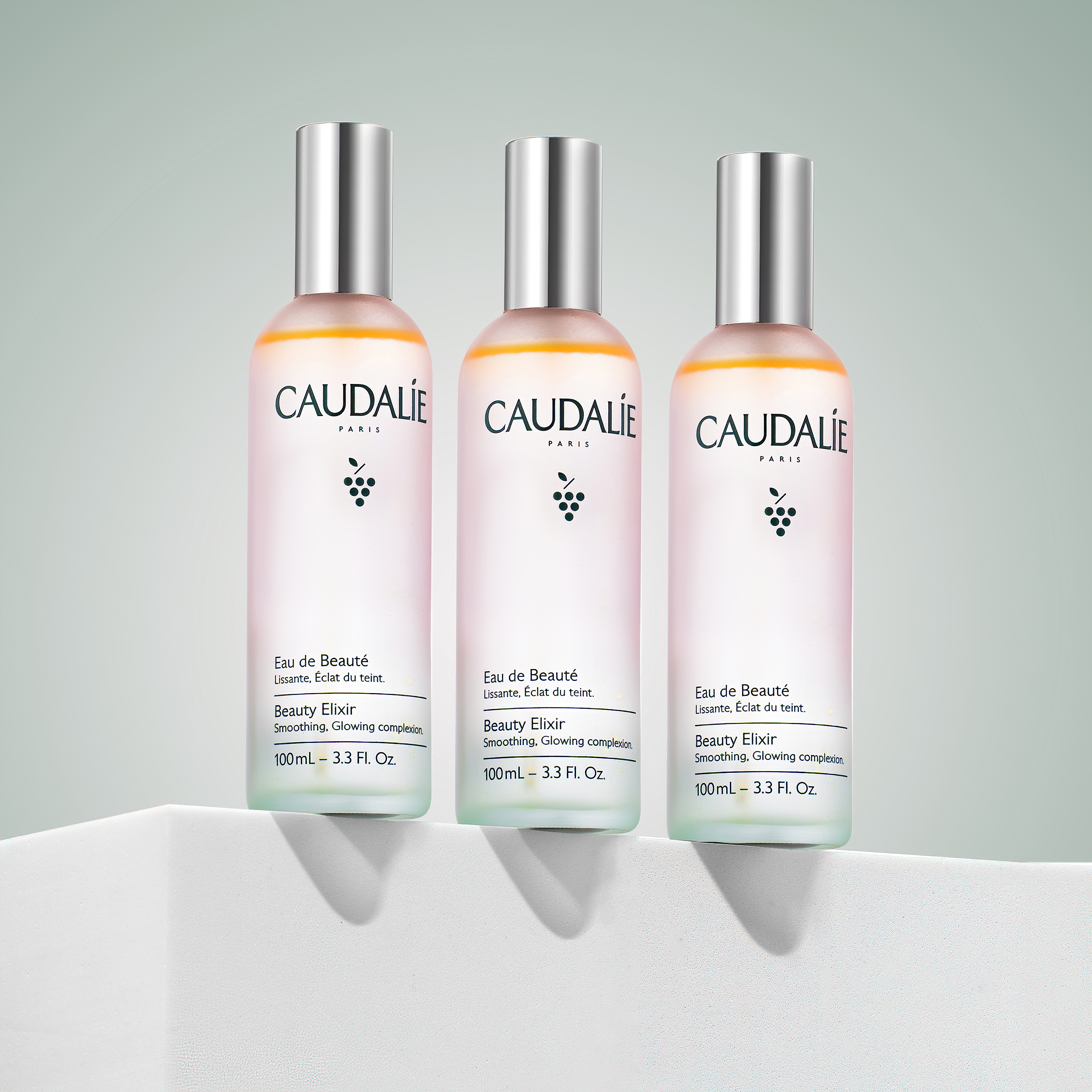 Professional skincare product photography of three Caudalie Beauty Elixir bottles photographed with clean studio lighting for ecommerce, advertising and beauty campaigns by Productpixels Singapore.
