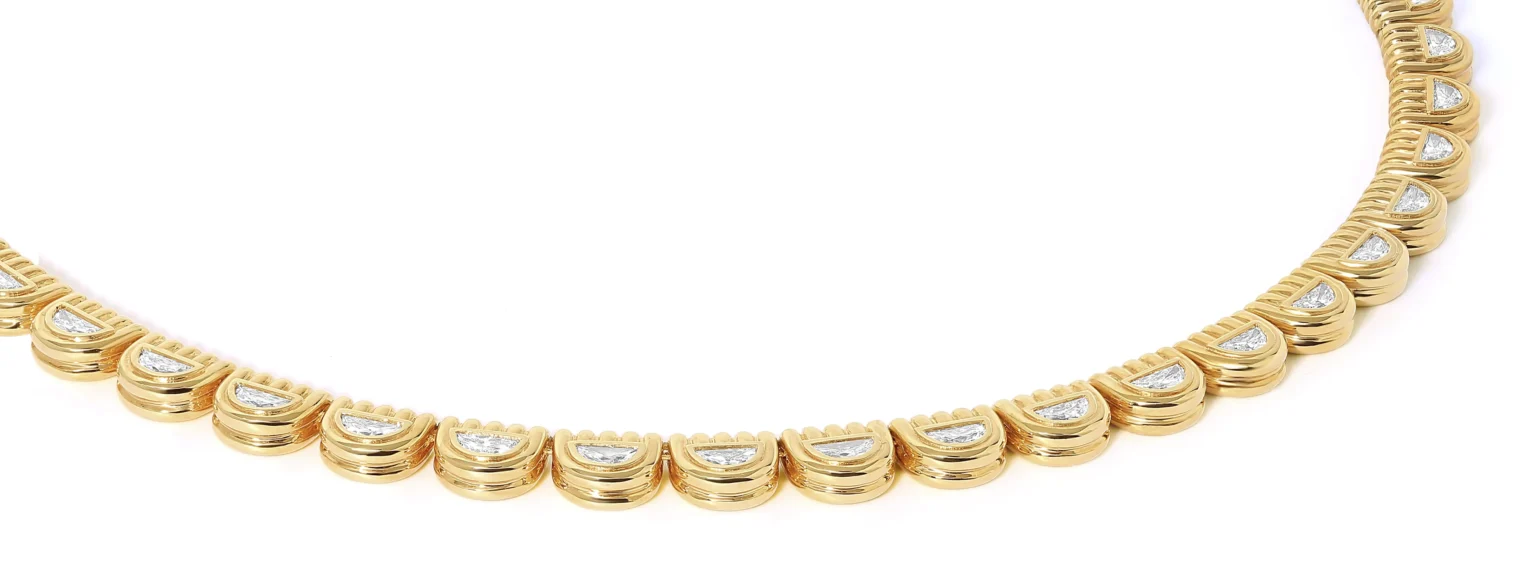 Gold necklace detail with diamond settings captured in jewellery photography by Productpixels Singapore