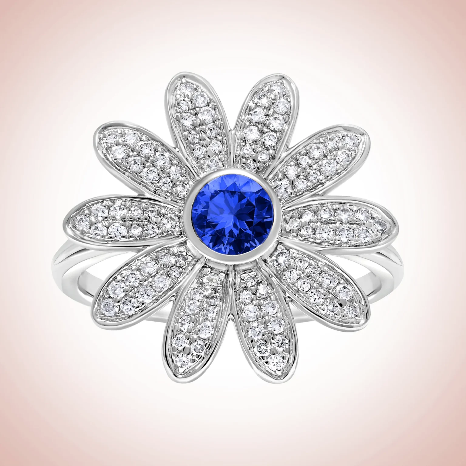 Helene Quan My Lovely Daisy Ring in 9K white gold with a central blue sapphire and diamond-pav&eacute; petals.