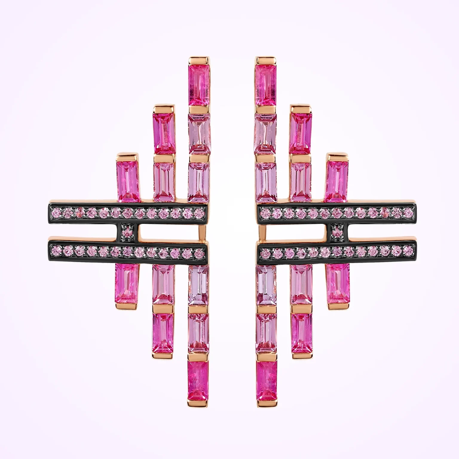 Pink sapphire statement earrings with baguette and round stones in geometric design on clean background.