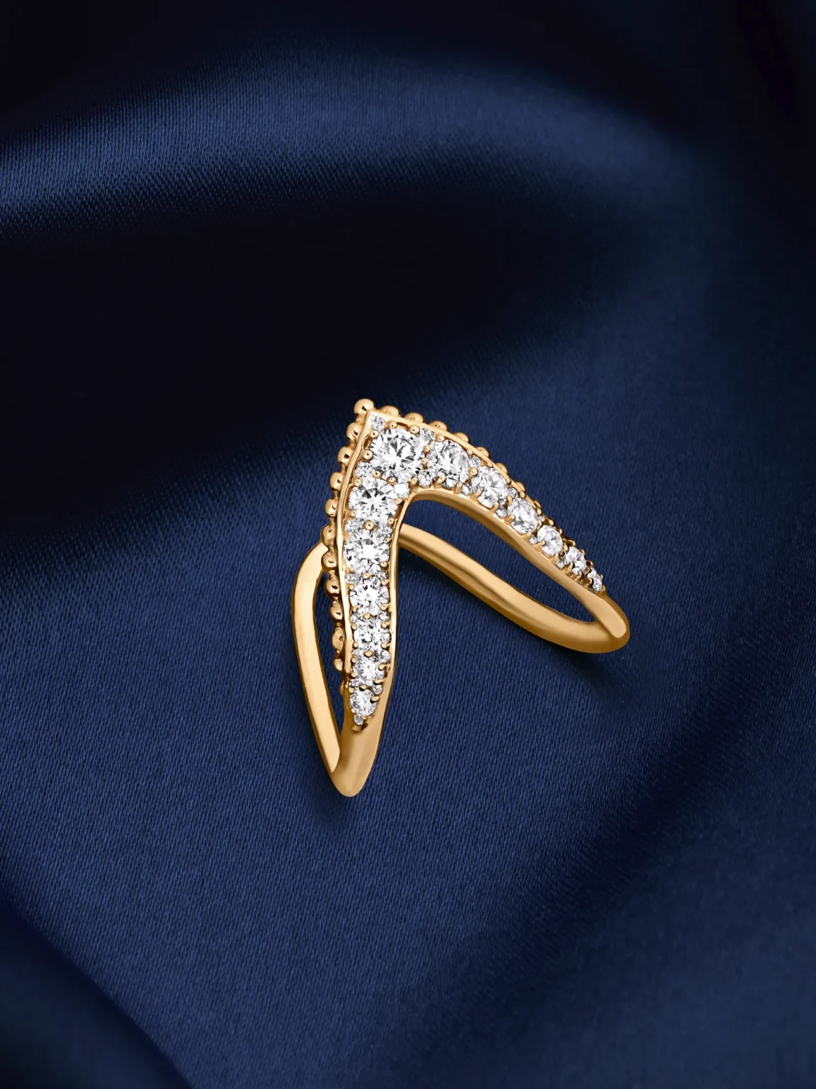 Diamond gold ring on blue silk jewellery photography Singapore