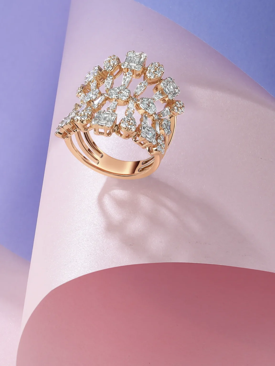 Diamond gold ring on pastel gradient background captured in creative jewellery photography by Productpixels Singapore