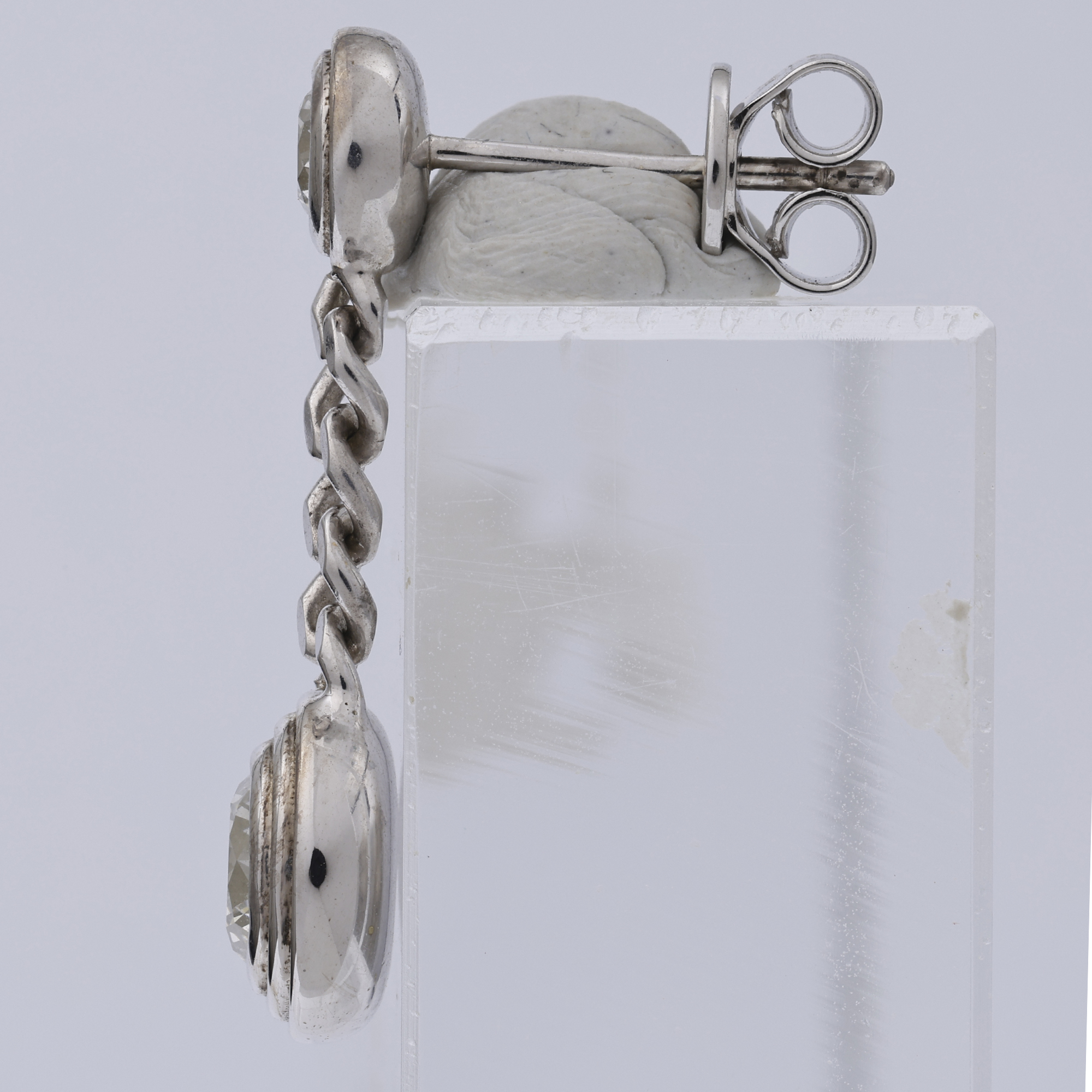 Raw jewellery product image of dangling earring before retouching with flat lighting and background Productpixels Singapore