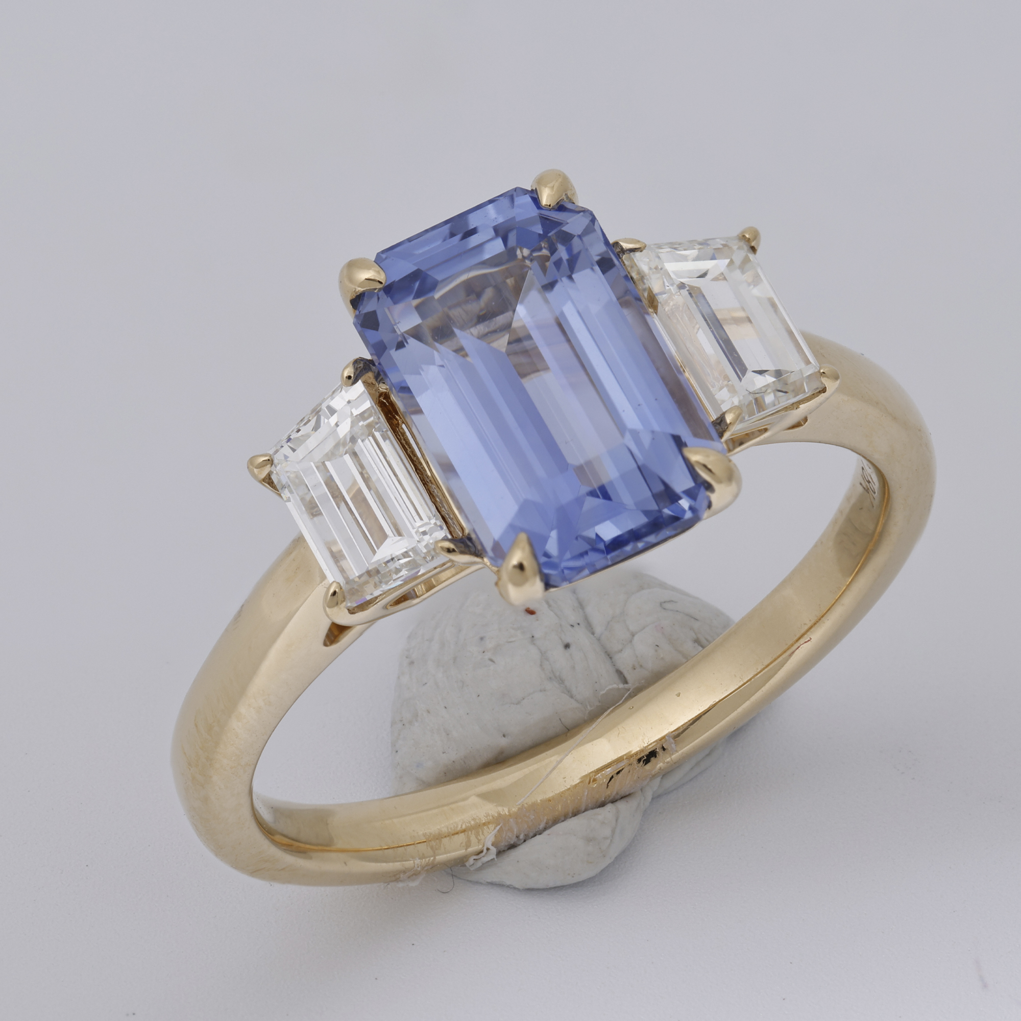 Raw jewellery product image of blue gemstone ring showing visible fingerprints, blue tac residue and unrefined setup before retouching Productpixels Singapore