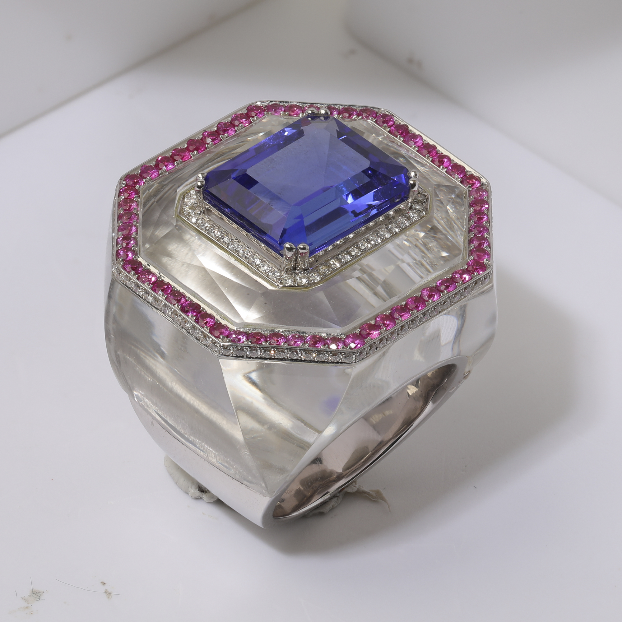 Raw jewellery product image of blue gemstone ring showing fingerprints, dust and blue tac support before retouching Productpixels Singapore