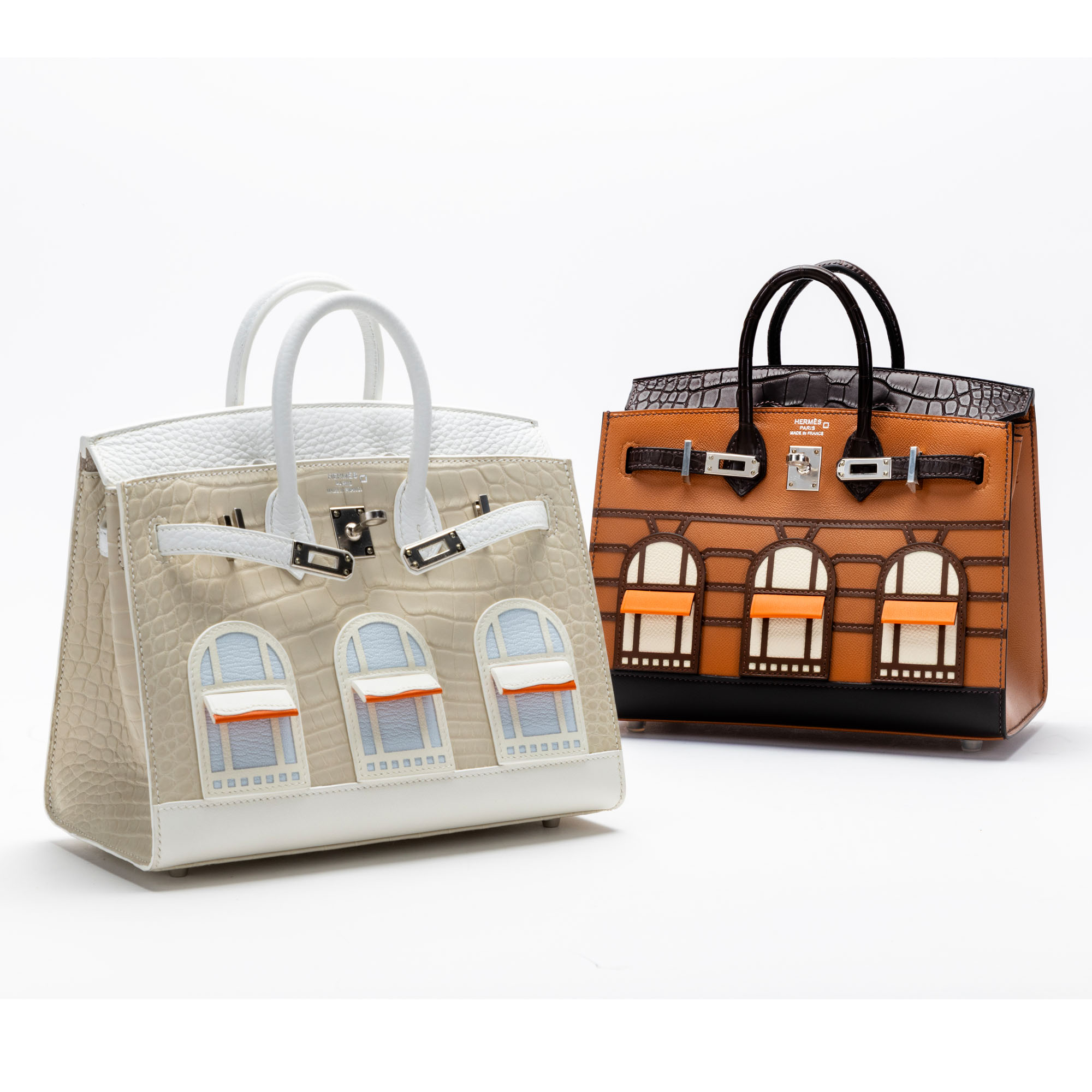Two architectural-inspired luxury handbags with textured leather, decorative window detailing and metal hardware, professionally photographed by Productpixels Singapore.